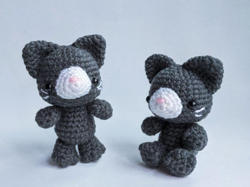 standing sitting cat amigurumi on white background